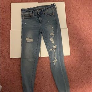 american eagle ripped blue jeans
